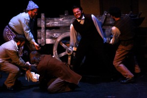 Jean Valjean saves a man's life by lifting a fallen wagon off of him. Photo by Ceillie Simkiss