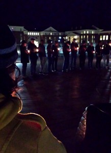 Students and faculty gather for a candlelight vigil for the loss of three UNC-Chapel Hill students.