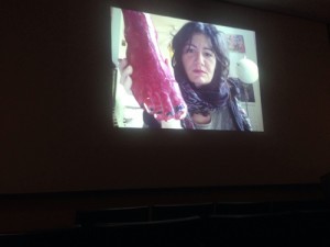 Slideshow presentation of Molly Zuckerman-Hartung holding a sculpture foot, March 29, 2016. Photo by Will Richards.