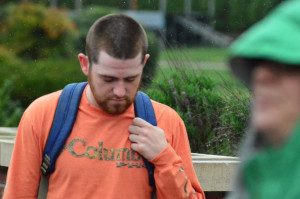 Jake Krauss praying at the fountain for Chancellor Belcher. Photo by Hunter Bryn