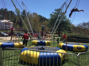 Students playing around on the bounce and play in front of the U.C. lawn. Photo by David Johnson. 