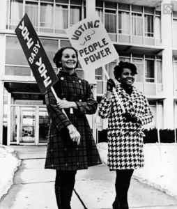Women encourage others to exercise their right to vote. Photo from The Huffington Post. 