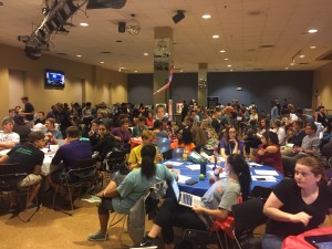 UC Illusions filled with over 100 students joined together to take in the record-breaking presidential debate. Photo by: Ashley Kairis