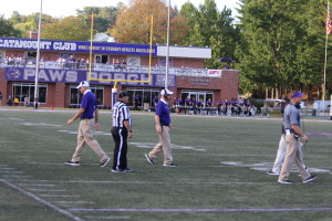 WCU Coach Speir walking toward midfield during a timeout. Photo by Marcus Smith.
