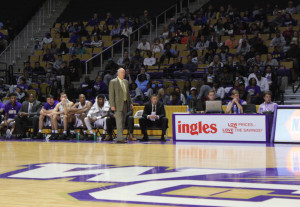 Coach Hunter standing court side. Photo by Marcus Smith.
