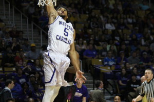 Devin Peterson leaping for a lay up. Photo by Calvin Inman.